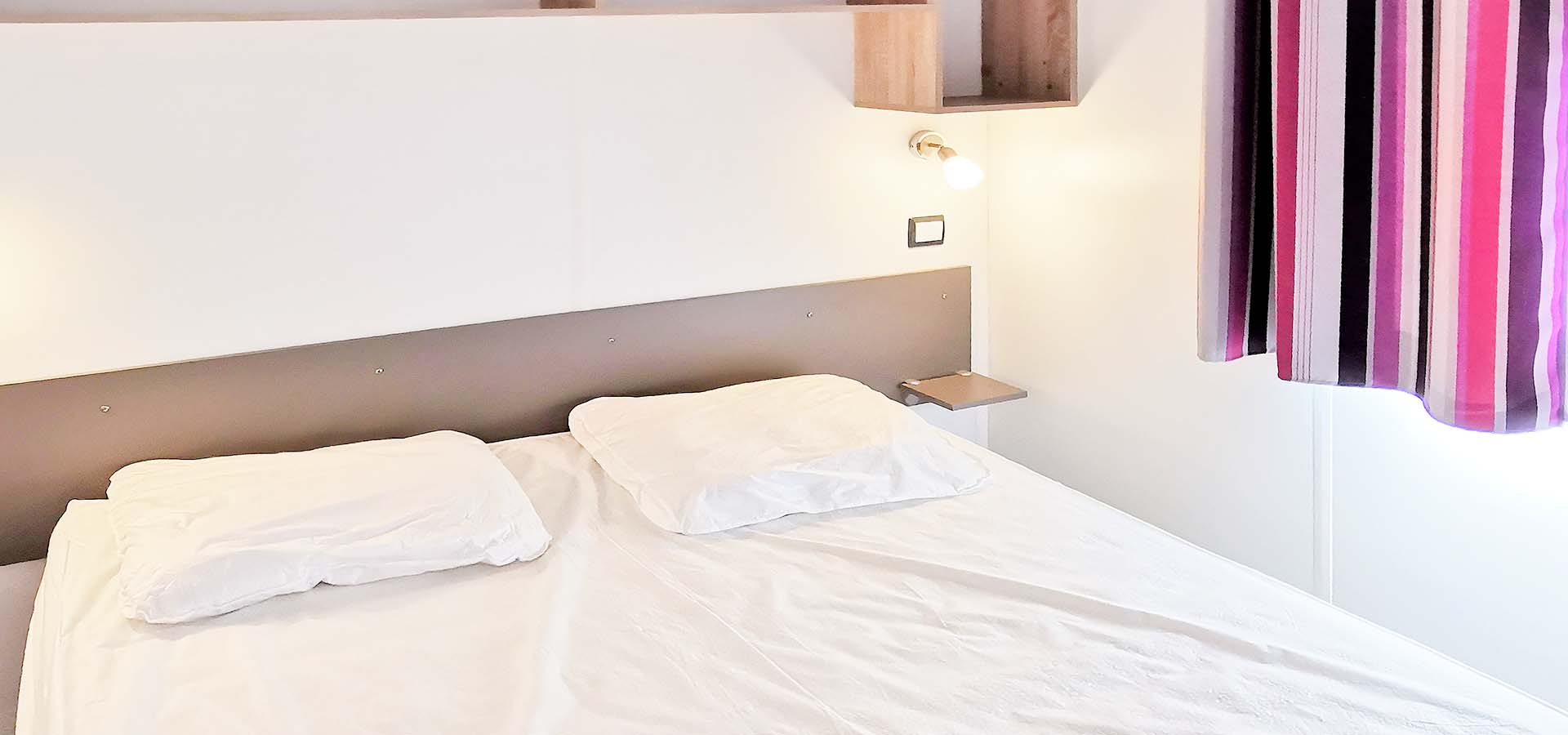 Camping kevano bungalow obione chambre principale