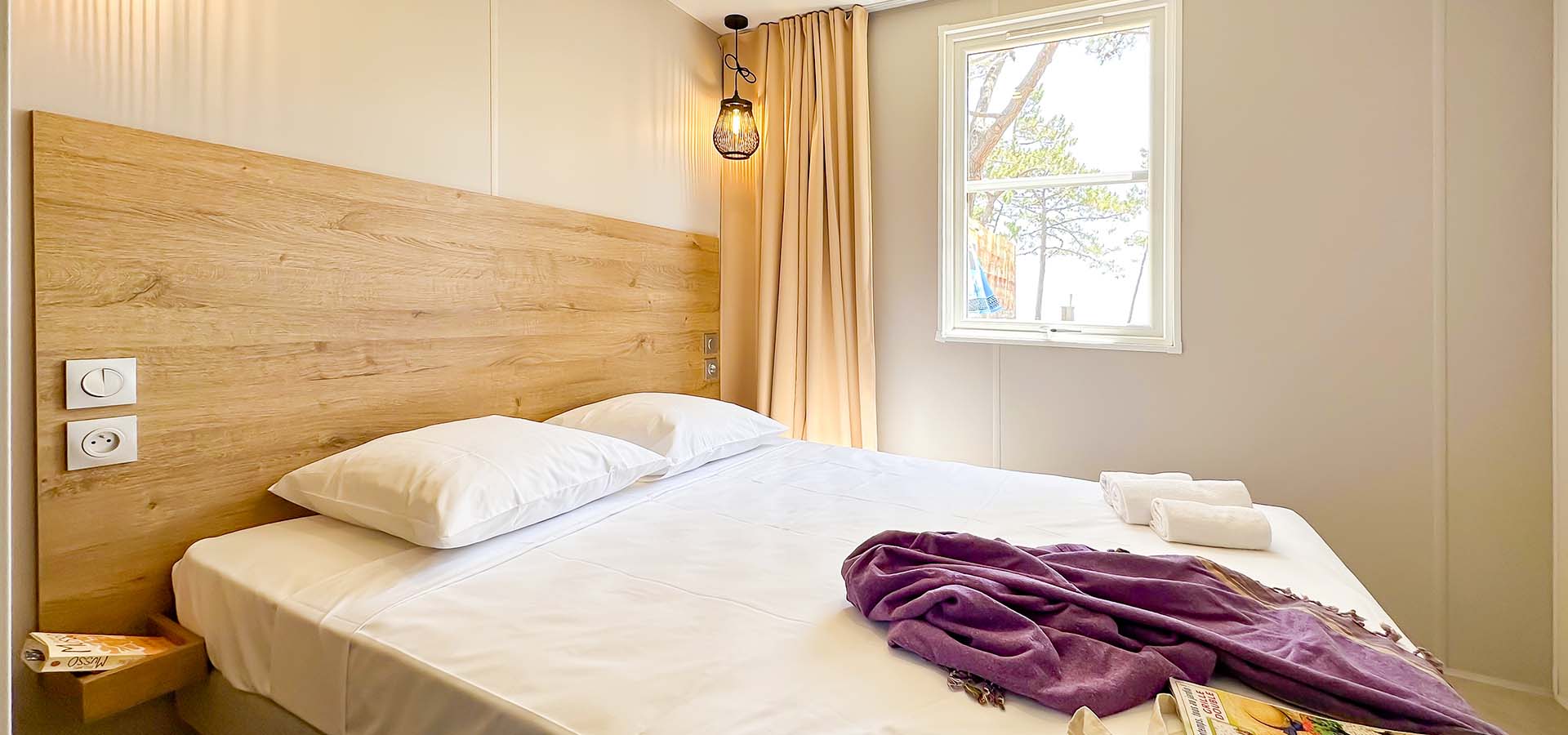 Camping san damiano bungalow Ultra lusso chambre principale musso